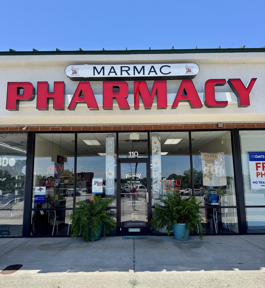 pharmacist greeting a patient inside Marmac Pharmacy